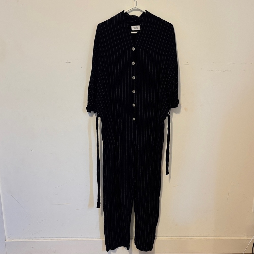Black rayon pinstripe jumpsuit with a linen look & feel.